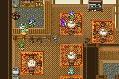La taverne de Carwen : tables à nappe, tapis rouges et piano en haut à droite (version GBA)