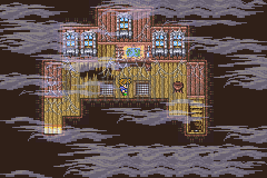 Un passage entre les coques, noyé dans la brume, avec une porte au centre (version GBA)