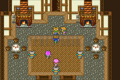 La maison de Kelger à Quelbe : grande salle au tapis central, foyers et loups-garous attablés (version GBA)