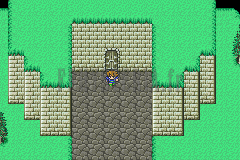 L’entrée du Temple Oublié : un portail de pierre au milieu de l’herbe (version GBA)