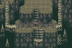Une salle de la Grotte des chimères, ses escaliers taillés dans la roche verdâtre (version GBA)