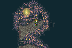 Une galerie bleu sombre de la Grotte du Veldt, un personnage près d’une lueur, un escalier en contrebas (version GBA)